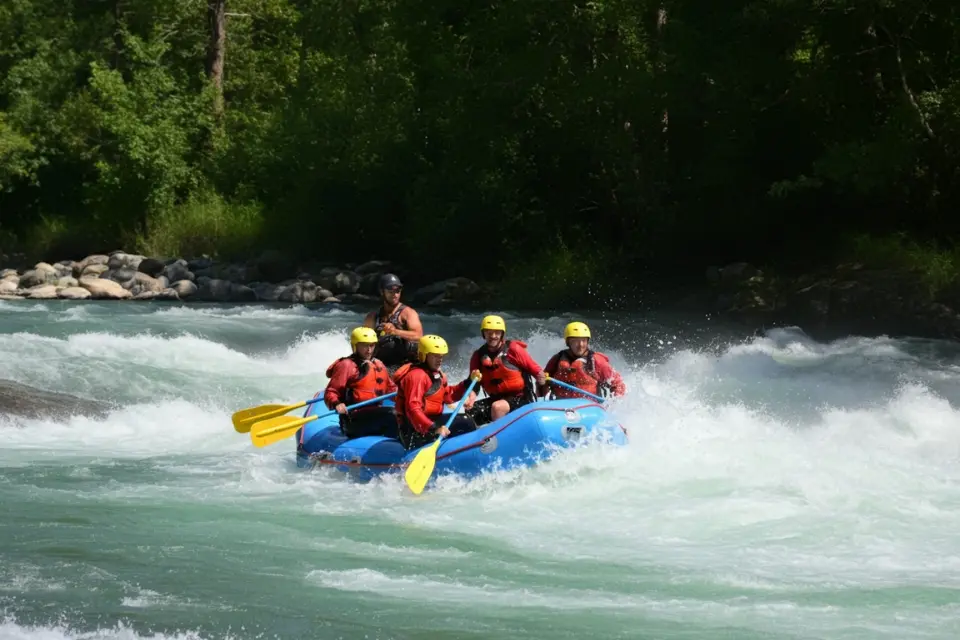 Experienced rafters navigating a Class IV rapid on the Colorado River with skill and teamwork.