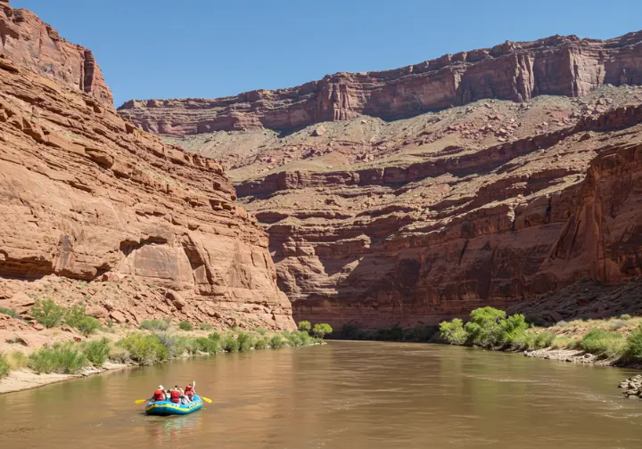 Scenic view of white water rafting in a New Mexico canyon, exploring the river landscape.
