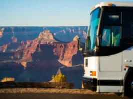 Grand Canyon travel packages worth the cost? View of the canyon with a tour bus subtly present.