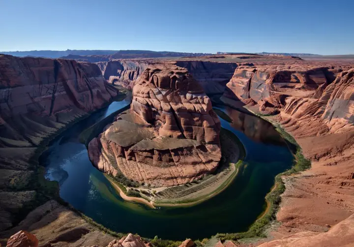 Visit Dead Horse Point State Park: Iconic view of the Colorado River's gooseneck bend from the overlook.