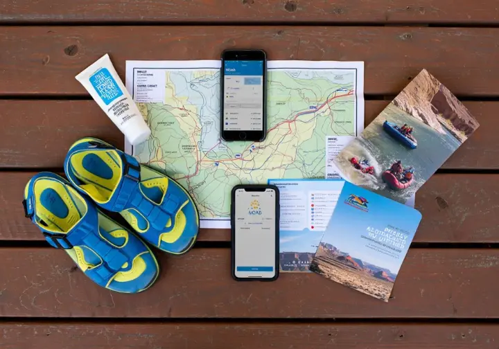 Planning your Moab rafting trip: Essential items including river map, sandals, sunscreen, weather app, and outfitter brochure.
