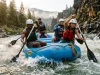 Best Whitewater Rafts for Every River 2026 Paddle crew running a self-bailing whitewater raft through a Class III rapid in morning light