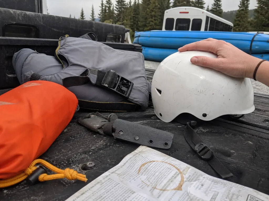 Rescue gear spread on a truck tailgate while a boater decides what to actually spend money on