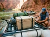 Best Cooler for Rafting That Survives a Flip Canyon Coolers Prospector rigged on a raft frame at a desert river put-in for a rafting trip
