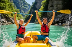 Europe’s Rivers: A Rafter’s Guide from Class II to V A fit young couple in a whitewater raft celebrate with paddles in the air on a beautiful emerald river in Europe.