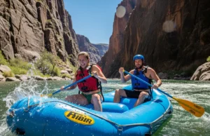 Middle Fork Salmon Rafting: A Data-Backed Planning Guide A full-body shot of an attractive young couple in swimwear and PFDs rafting down the Middle Fork of the Salmon River through a sunlit granite canyon.