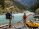 Packrafting vs. Backpacking: A River Safety & Gear Analysis A man with a backpack and a woman with a packraft stand on a riverbank, illustrating the choice between hiking and water travel.