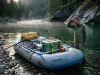 3 Raft Frame Types Compared Before You Overbuy Rigged AIRE raft frame with Sawyer oars at a river put-in on a calm canyon morning
