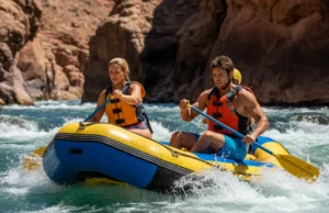 Decoding River Features: A Rafter’s Safety Guide A full-body shot of a young man and woman in a raft, safely navigating a whitewater rapid by reading the river's currents.