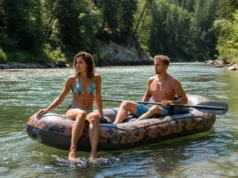 Read Any River: The River Continuum Concept Explained A man and woman in their late 20s on a raft, looking downriver to illustrate the concept of reading the water.