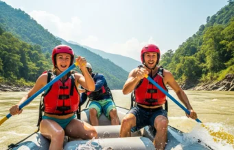 Sun Kosi River Rafting: A Grade II-V Technical Analysis A fit young couple in helmets and life jackets energetically paddling a raft through a large rapid on the Sun Kosi river in Nepal.