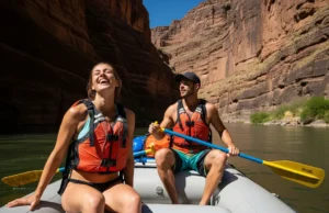 Treating Hypothermia with Raft Gear: A Step-by-Step Guide A full-body shot of a happy, fit couple in their late 20s wearing PFDs and swimwear while rafting down a sunny river.
