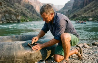 7 Steps to a Hypalon Raft Repair That Actually Holds Boater patching a Hypalon raft tube on a gravel river bar at golden hour