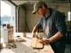 Is Your Raft Paddle Worth Repairing? Here’s How Rafter inspecting a cracked raft paddle blade on a garage workbench before repair