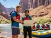 The River Trip Safety Plan: A Rafter’s Blueprint A male trip leader gives a safety briefing to his rafting group on a sunny riverbank, pointing at a map before their trip.