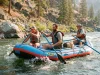 Best Whitewater Rafts for Beginners Ranked by Ease Beginner crew paddling an NRS Otter self-bailing whitewater raft through a Class II wave train
