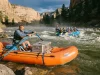 Paddle Raft vs Oar Raft vs Hybrid Which Fits Your River Oar raft and paddle raft running the same rapid, showing the paddle raft vs oar raft choice