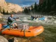 Paddle Raft vs Oar Raft vs Hybrid Which Fits Your River Oar raft and paddle raft running the same rapid, showing the paddle raft vs oar raft choice