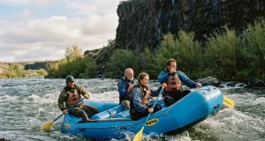 Why Self-Bailing Beats Bucket Boats Until It Doesn’t Self-bailing raft floating high through a wave train with water draining off the floor