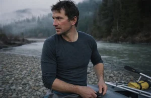 Cold-Water Rafting Base Layers Guides Swear By Rafter in a merino base layer rigging at a cold river put-in before a cold-water run