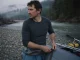Cold-Water Rafting Base Layers Guides Swear By Rafter in a merino base layer rigging at a cold river put-in before a cold-water run