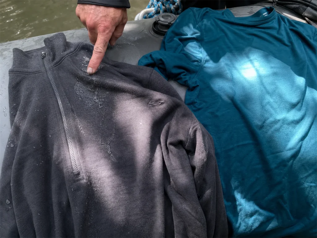 Merino base layer and a synthetic top laid on a raft tube comparing rafting base layer materials