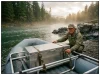 Best Dry Boxes for Rafting You Can Actually Buy Aluminum dry box strapped to a raft frame on a gravel river bar at dawn