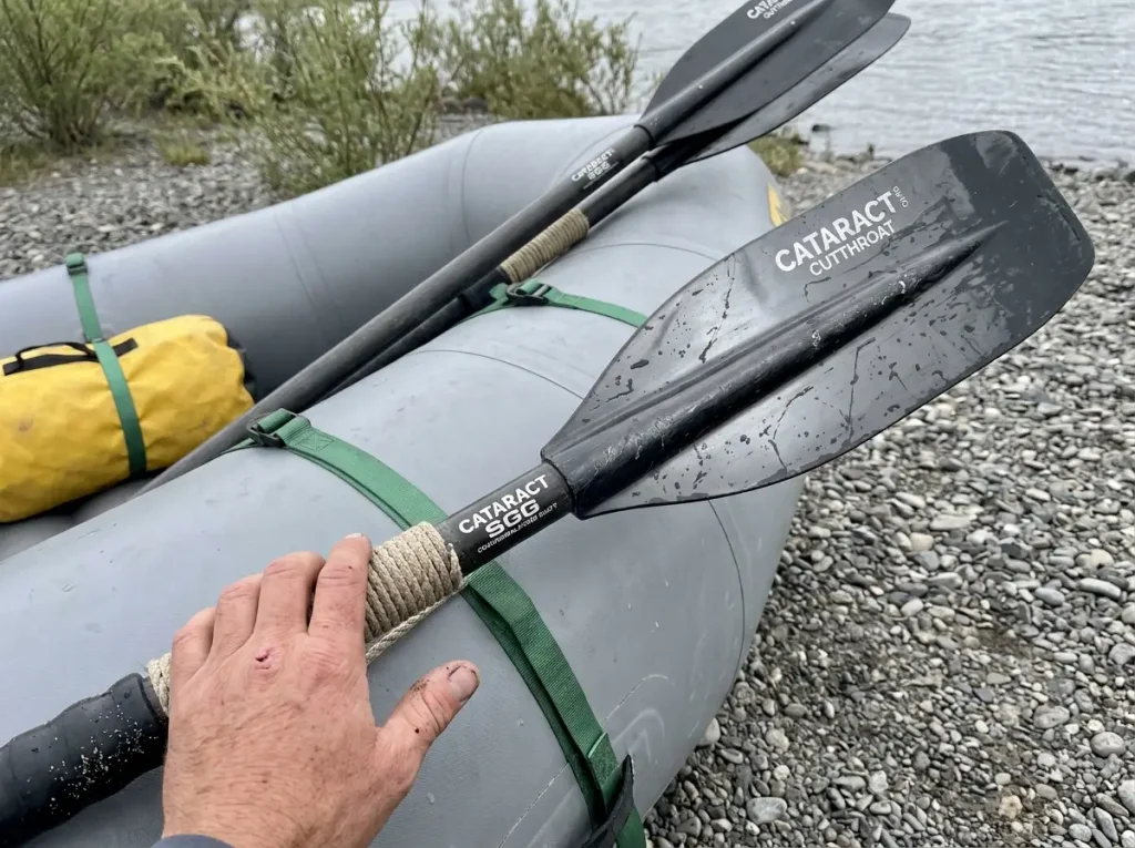 Cataract composite oars leaning on a raft showing Cataract makes oars not frames