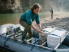 Cataract vs NRS vs DRE Frames One Makes Oars Boater rigging an NRS Bighorn II raft frame at a river put-in comparing raft frame brands