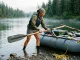 The Oar Length Formula River Guides Actually Use Rower checking oar length on a raft frame rigged with Sawyer Polecat oars at the put-in