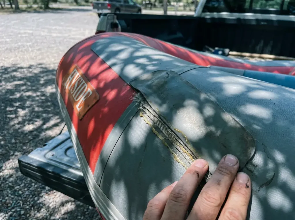 Close-up of a hand-glued Hypalon raft seam versus welded PVC, explaining how material affects raft lifespan