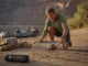 Best Fire Pans for River Trips That Pass a Ranger Check Lightweight fire pan set up on a Grand Canyon sand beach at camp on a multi-day river trip