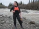 Best Rescue PFDs Type V and Who Should Skip Them Safety boater in an Astral GreenJacket rescue PFD, a Type V rescue vest, on a cold spring river