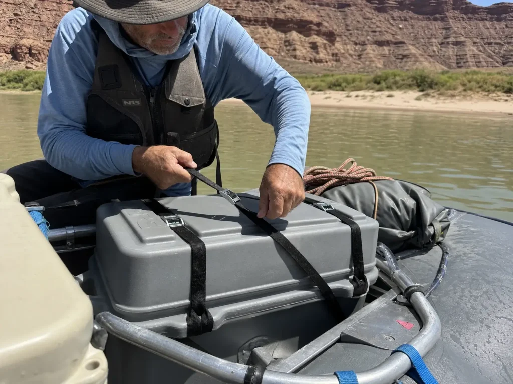 Desolation/Gray Canyon, Green River, Utah — sandstone canyon wall, silty green-brown water